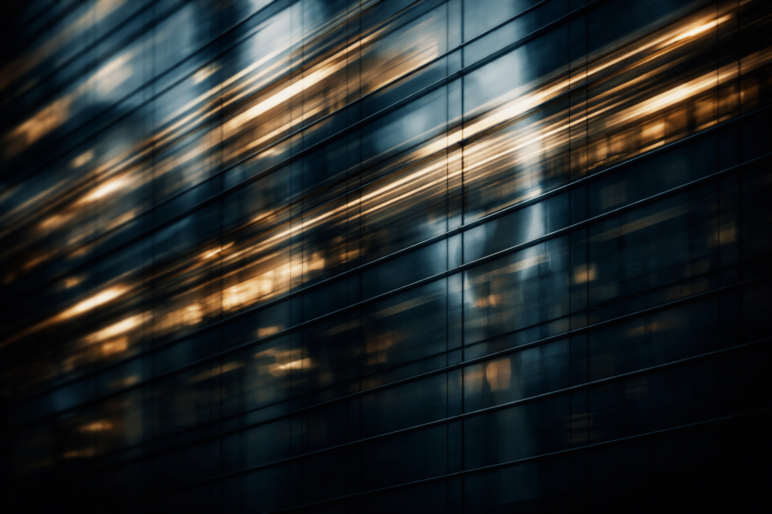 Close-up motion-detail of an anonymous glass-and-steel office façade with diagonal streaks of reflected city lights in cool blues and warm golds, with the lower third left empty.